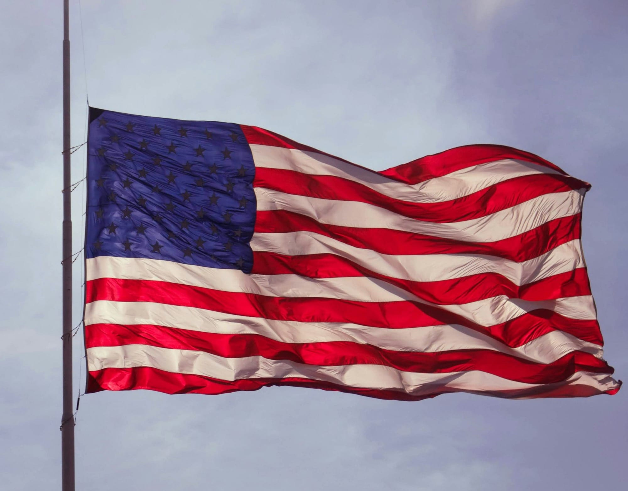 U.S. flag under blue skies